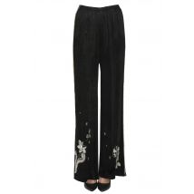 Pantaloni in velluto con ricami ed applicazioni