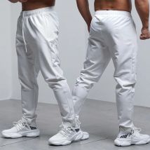 Pantaloni da corsa larghi traspiranti da uomo autunno inverno allenamento sportivo palestra abbigliamento sportivo elastico impermeabile tasca con zip esterna pantaloni sportivi