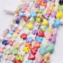 Misto 20 pz/lotto perline di ceramica stella di pesce stella marina fiori elefanti cuore perline distanziatrici allentate per gioielli che fanno braccialetto fai da te