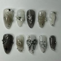 24Pcs Fałszywe paznokcie Spicy Girl Silver Bow z diamentowymi sztucznymi paznokciami z klejem Almond Press on Nails Black Cool Y2k Almond Nail Set