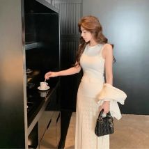Elegantes, langes, ärmelloses Strickkleid mit Rundhalsausschnitt, aushöhlen, grenzüberschreitend, Frühling und Sommer, neuer Stil, modisches Perlenkleid