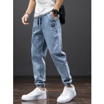 Primavera Verano negro azul Cargo Jeans hombres ropa de calle Denim Jogger pantalones hombres holgados Harem Jean pantalones de talla grande