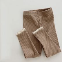2025 0-6 anni autunno nuovo bambino a costine leggings di pizzo ragazza bambino solido leggings pizzo piede bocca pantaloni scarni abbigliamento per bambini
