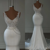 Personalizzato 2026 lussuoso sirena perla e ricamato abito da sposa bianco con scollo a V senza maniche backless abito da sposa da donna sexy