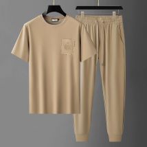 Set di t-shirt a maniche corte tinta unita di nuova tendenza estiva della moda Set da due pezzi di grandi dimensioni sportivo allentato da uomo confortevole e traspirante