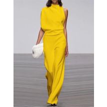 Tute senza maniche irregolari di colore solido Moda donna Temperamento Sexy Backless Pieghe leggermente svasate Tuta femminile 2025