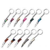 Ciondolo mini coltello pieghevole in acrilico da 5 cm Portachiavi in legno di ottone Lama piccola affilata Coltello da unboxing da campeggio esterno appeso portatile