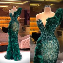Abiti da sera a sirena con applicazioni di perline di lusso Abiti da festa formali con paillettes glitterate e volant laterali eleganti