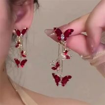 Eleganti orecchini pendenti a farfalla con zirconi rossi per le donne Temperamento Orecchini con fiocco in metallo dolce Accessori per gioielli per ragazza di moda