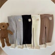 Koreańskie jesienno-zimowe nowe dziecięce jednoczęściowe legginsy unisex chłopcy dziewczęta dziecko zimno zapobiegają ciepłym kreskówkowym elastycznym spodniom z wiązanymi stopami