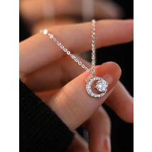 A 925 silver 0.5 carat moissanite sparkling crescent necklace. Moon niche design moissanite necklace