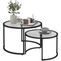 Set Aus 2 Runden, Ineinander Schiebbaren Couchtischen Mit Tischplatten Aus Gehärtetem Glas Und Beinen Aus Schwarzem Kohlenstoffstahl.