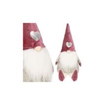 Skrzat navideño de 40 cm, un gnomo sentado con las piernas colgando.