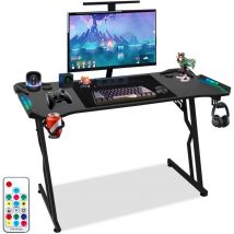 SWANEW Bureau Gaming Bureau de jeu avec Porte-gobelet et Crochet pour Casque, 140x60cm, Plateau en Fibre de Carbone, met LED+télécommande