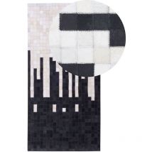 Beliani - Tapis Rectangulaire 80 x 150 cm en Peau de Vache Noir et Crème Moderne Pixel Bolu
