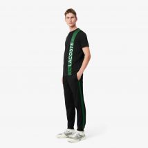 Lacoste - Pantalon de survêtement Tennis imprimé - Couleur : Noir / Vert