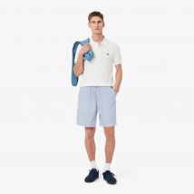 Lacoste - Short relaxed fit rayé - Couleur : Bleu / Blanc