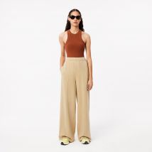 Lacoste - Pantalon de survêtement large avec badge - Couleur : Beige