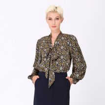 Ascot-tie blouse en kunst-deco print