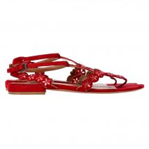 Alaïa Flower Lasercut Enkelband Flate Sandalen in Rood Suède