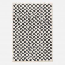 Dark blue and cream shaggy checkerboard interior rug,