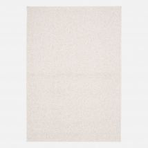 Cream mottled effect loop pile interior rug,