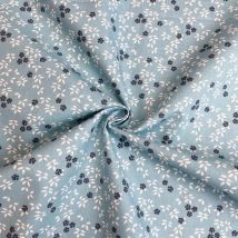 Tissu cretonne coton bleu ciel motif pensées pétales