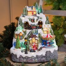 Village de Noel animé à LED avec montagne Enneigé Petit Train Sapin de Noël et Père Noël H31cm Lotti