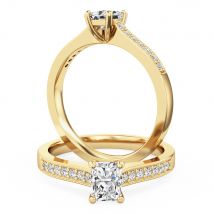 A beautiful radiant cut diamond ring with shoulder stones in 18ct yellow gold