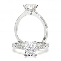 A beautiful radiant cut diamond ring with shoulder stones in 18ct white gold
