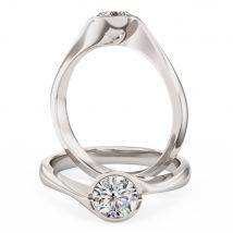 A unique round brilliant cut solitaire diamond ring in 18ct white gold