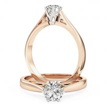 A round brilliant cut solitaire diamond ring in 18ct rose & white gold