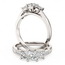 A stunning three stone princess cut diamond ring with shoulders stone in 18ct white gold