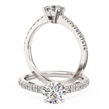 An exquisite solitaire diamond ring with shoulder stones in 18ct white gold