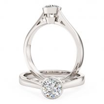 A modern round brilliant cut solitaire diamond ring in 18ct white gold