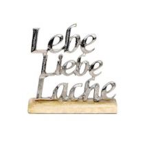 Schriftzug 'Lebe Liebe Lache' aus Aluminium auf Holzfuß